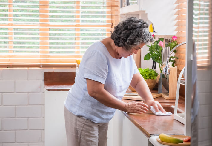 Woman Cleaning Kitchen